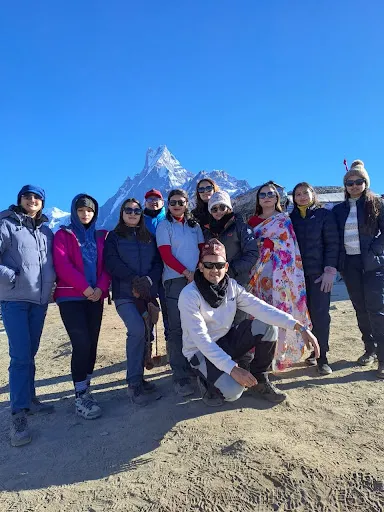 Trekkers enjoying views of mountains in Mardi Himal Viewpoint after walking through the Mardi Himal Trek Route.