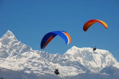 Paragliding in pokhara with beautiful mountains in the back
